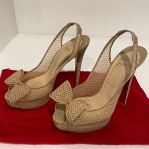 Authentic Christian Louboutin peep toe pumps.
